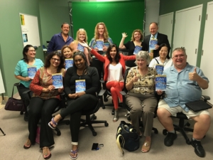 keynote speaker with book