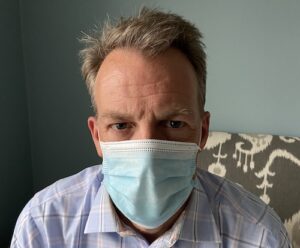 listening to angry person wearing a mask