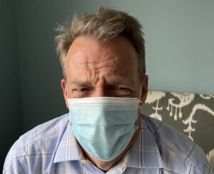 listening to person who is disgusted wearing a mask