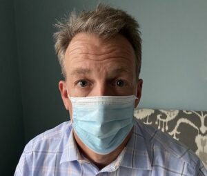 listening to fearful person wearing a mask