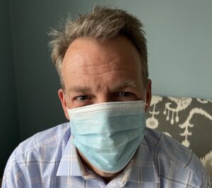 listening to happy person wearing a mask