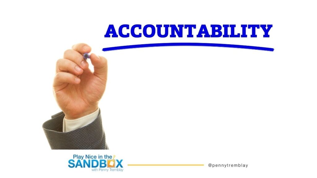 image of hand writing on a board "Accountability" in blue to hold people accountable