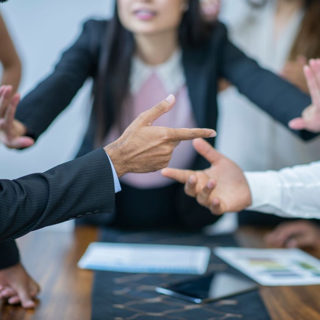 image of woman between 2 men arguing to avoid a costly termination