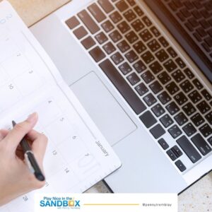 image of a laptop and a calendar book to create a business plan
