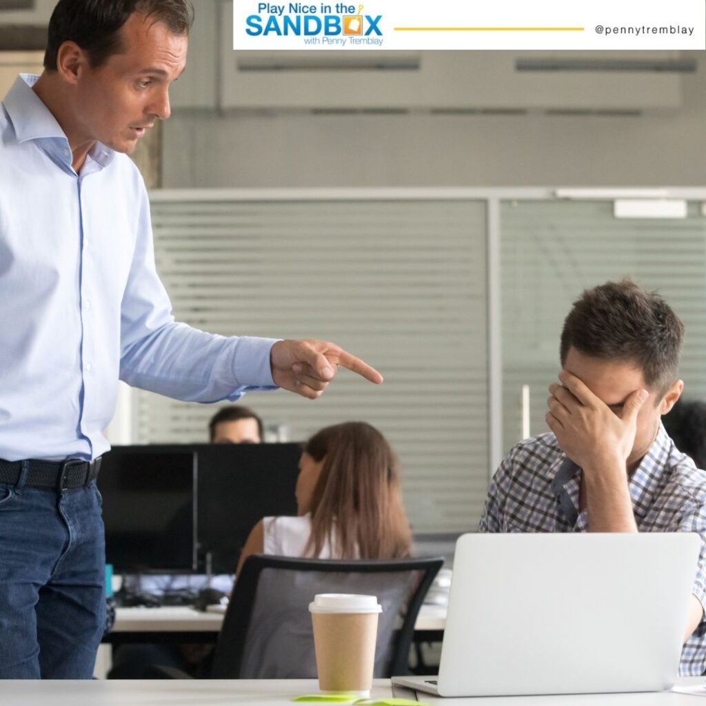 image of a boss pointing a finger at employee and employee has his hand over his face as they are in conflict