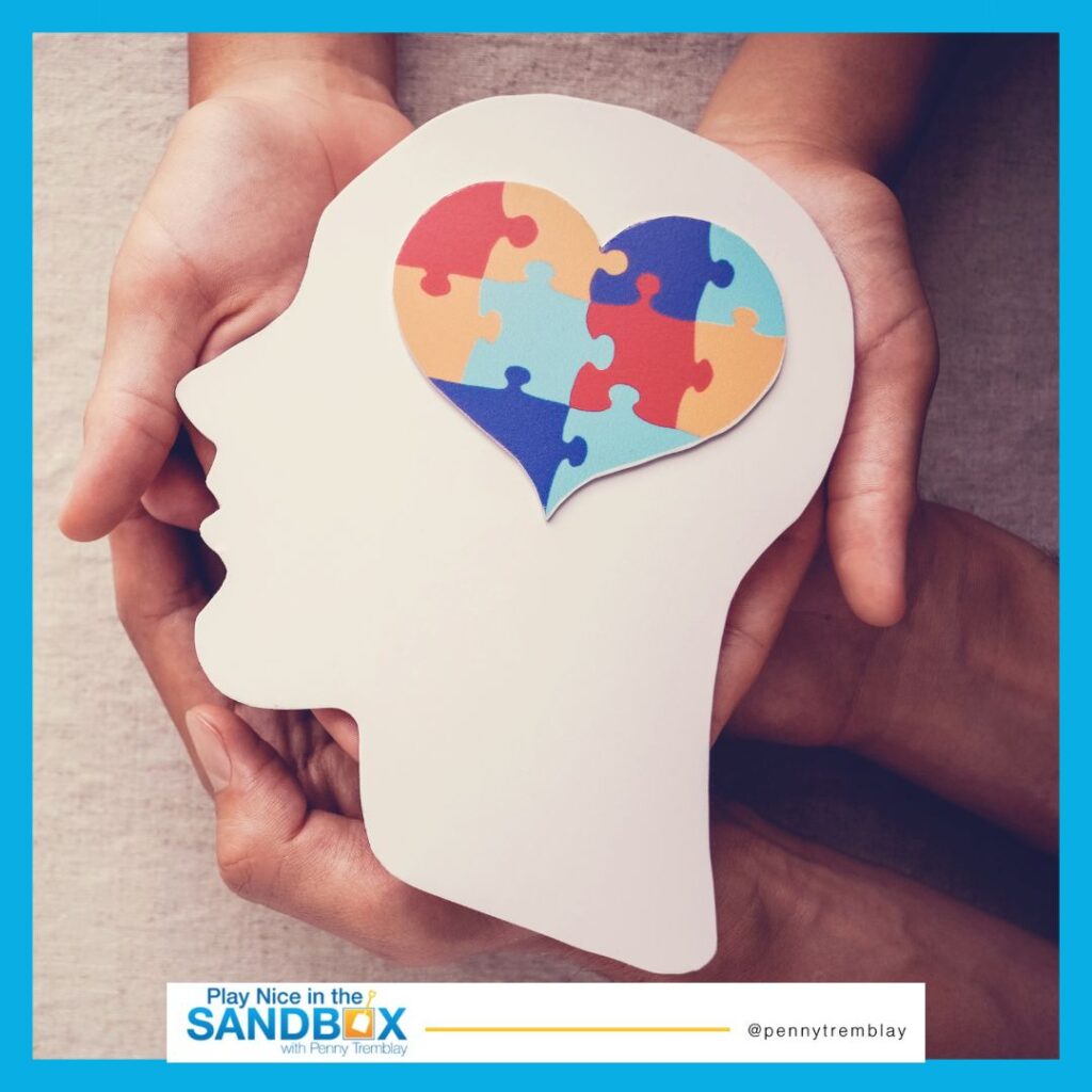 image of a cutout of a head with colourful puzzle pieces making up a heart where the brain should be to signify mental health