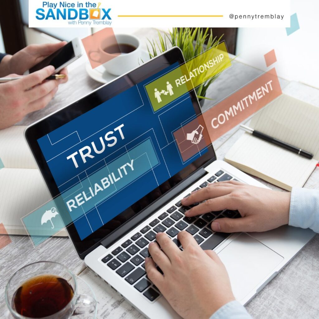 image of a person with their hands on the keyboard of a laptop with Trust on the screen