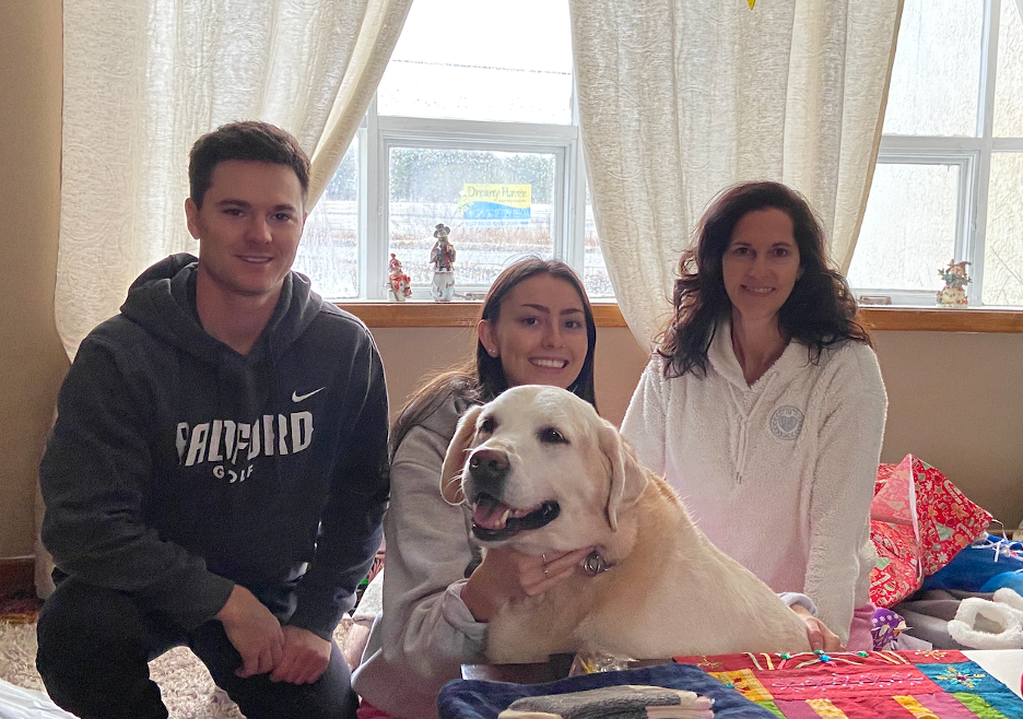 image of Penny, her children and their dog Joy enjoying the holiday season together