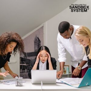 image of coworkers looking at a laptop screen and paperwork together to show Why Overusing Workplace Investigations Is a Horrible Option