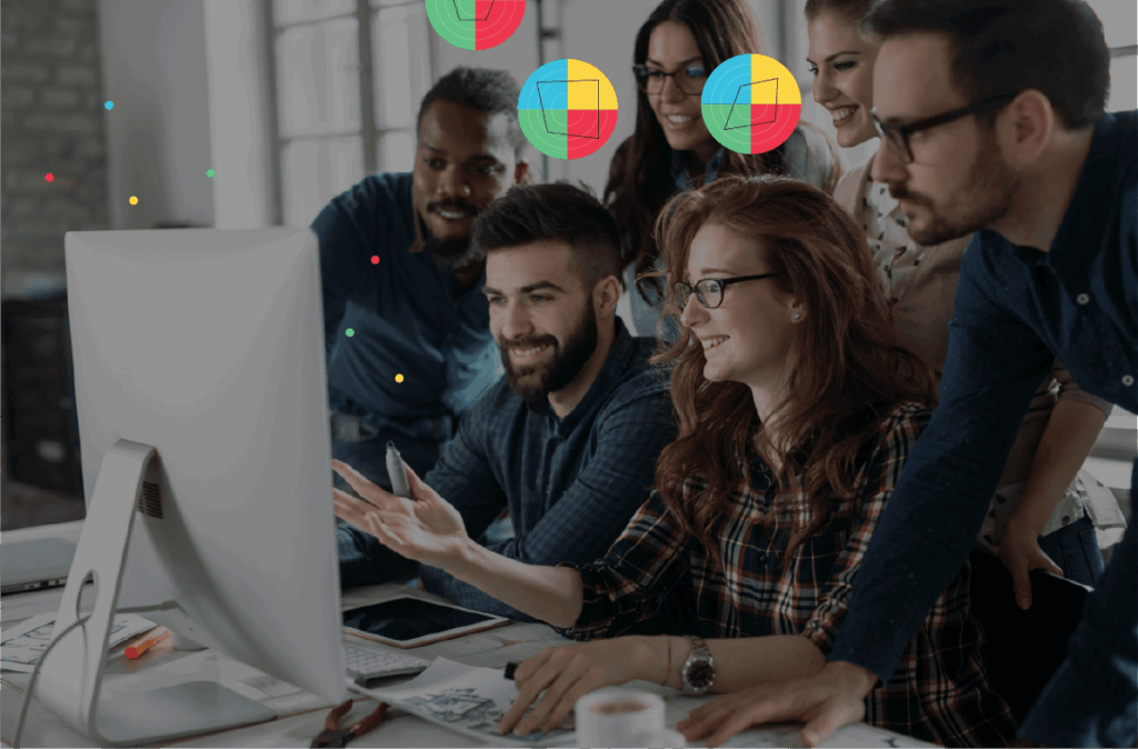 image of a group of people sitting together looking at a computer screen and symbols above their heads to show Whole Brain® Thinking