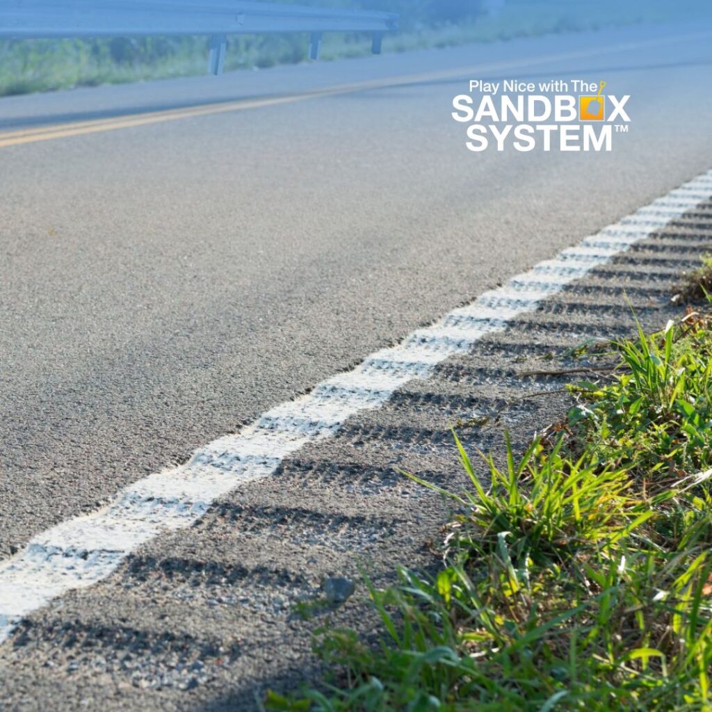 image of a roadway with Guard Rails and Rumble Strips